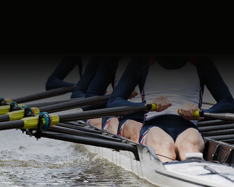 Photograph of a group of people rowing